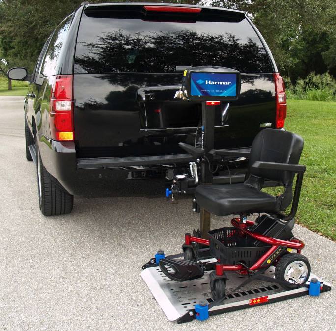 Mobility chair attached to a Harmar vehicle lift.